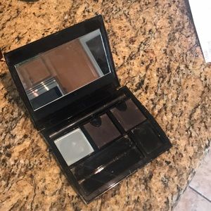Mary Kay compact, the large one.